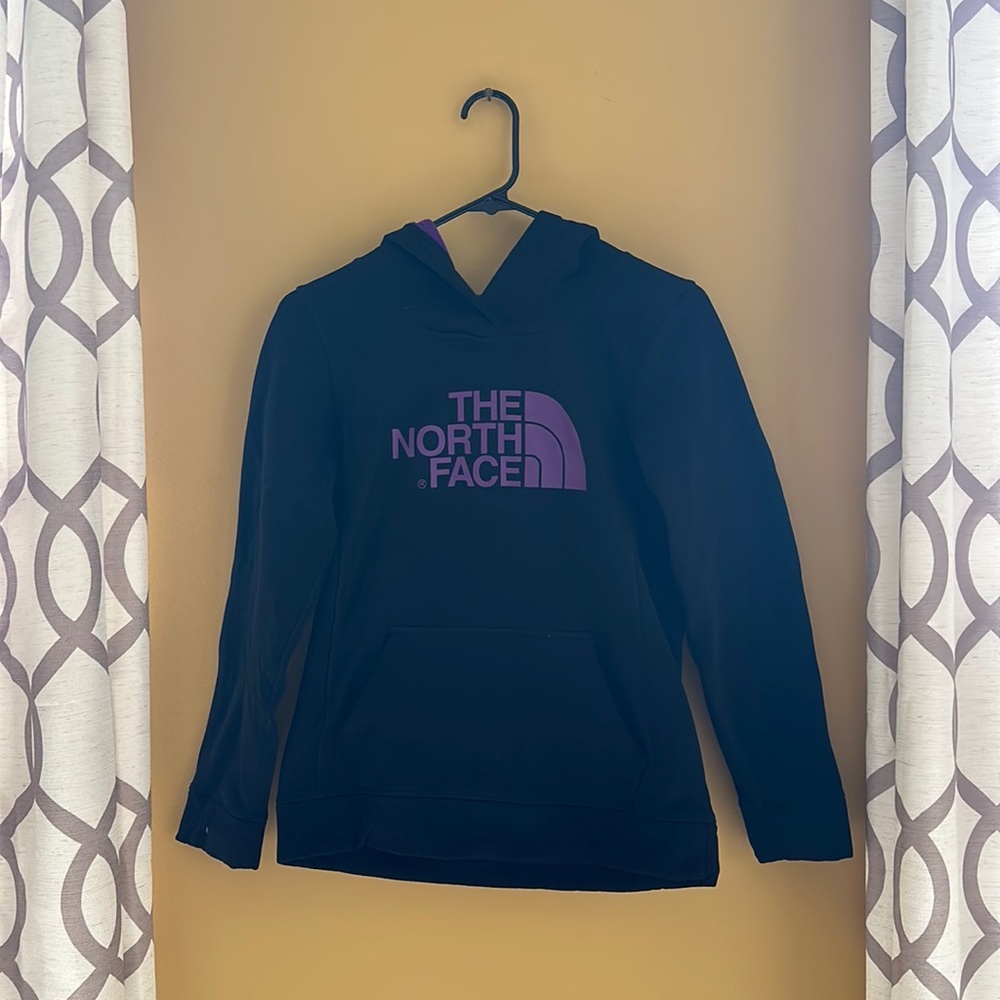 The North face woman’s Small black and purple hoodie